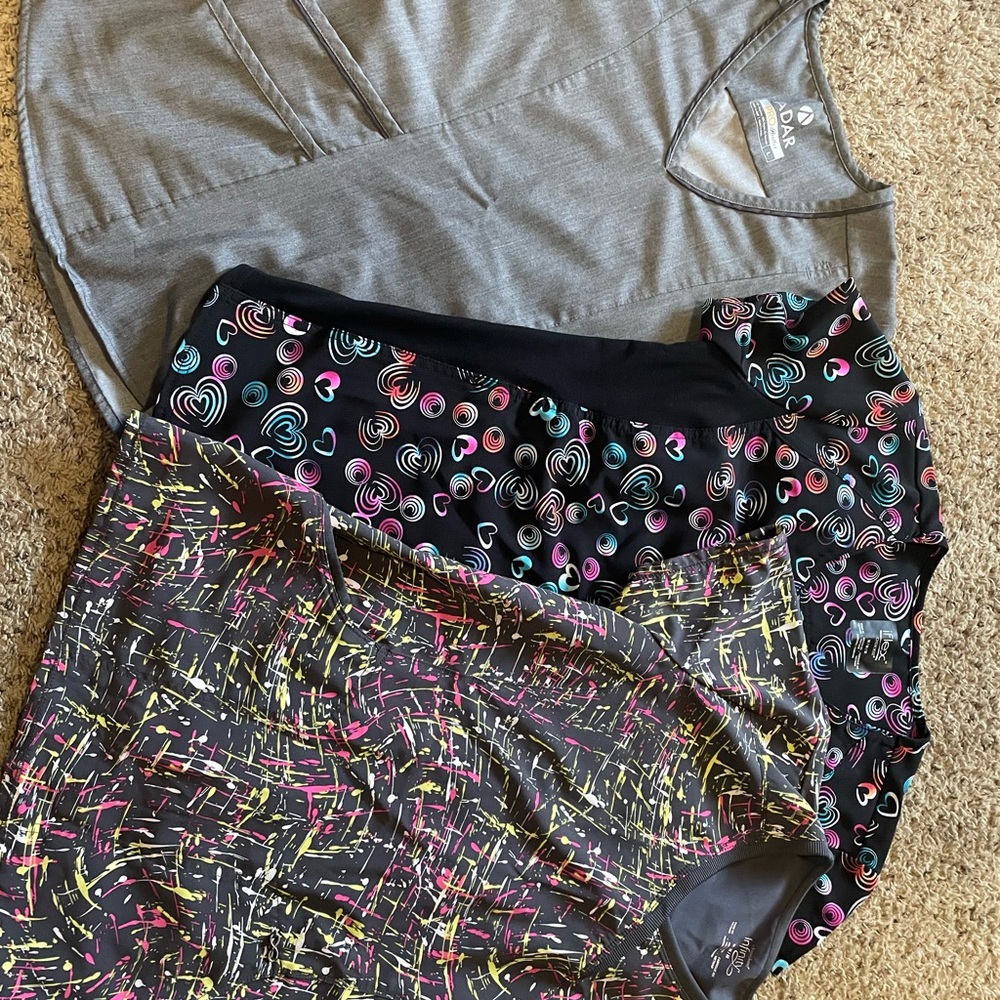 Scrub tops, like new. Sizes on pics, $20 each or all 3 for $50.